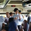 Wakil Wali Kota Palu, Imelda Liliana Muhidin, menyapa langsung para pemudik dalam program Mudik Gratis 2025 di dalam bus setibanya di Terminal Tipo, Palu. Foto: Pemkot Palu 