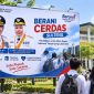 Baliho program Berani Cerdas Sulteng dengan foto Gubernur Anwar Hafid dan Wakil Gubernur Reny Lamadjido